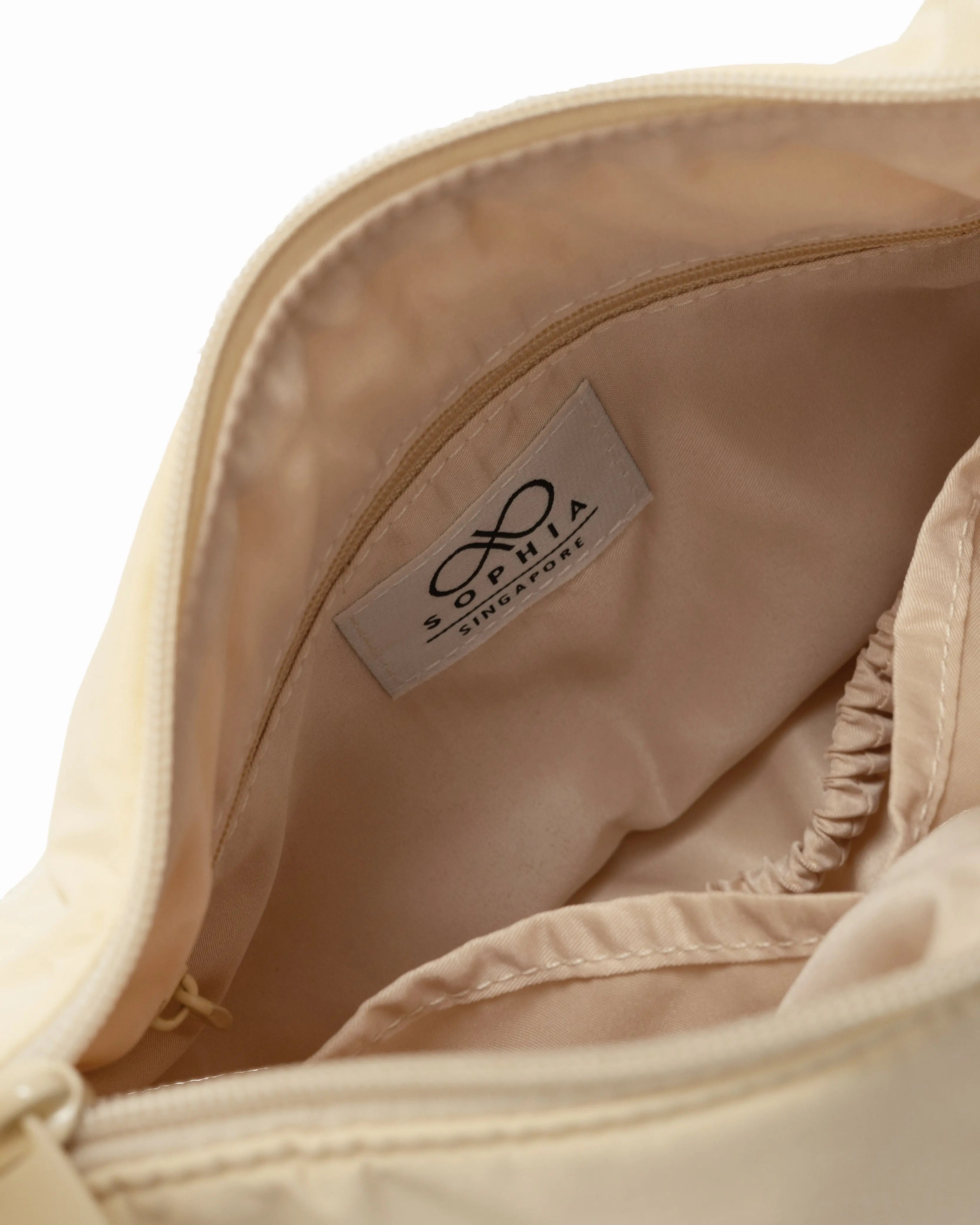MINI SIGNATURE POCKET CROSSBODY BAG IN POSH MELLOW