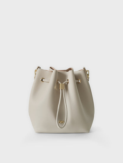 MINI REINA MAGIC BUCKET BAG IN ALMOND